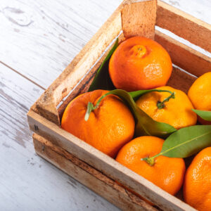 top view fresh oranges in wooden box